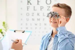 Little boy undergoing eye test in clinic