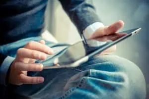 close up of person holding tablet